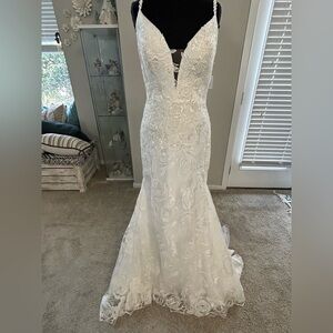 Luv bridal ivory, delicately beaded lace fit, and flair bridal gown